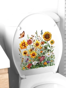 Detail of floral butterfly decals showing vibrant sunflowers and daisies on toilet lid