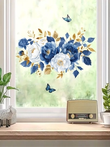 Detail of blue roses wall stickers with golden leaves and butterflies in a home setting