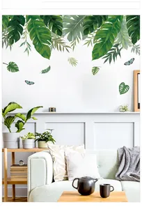 Vue détaillée des stickers muraux feuilles de monstera tropicales et papillons bleus