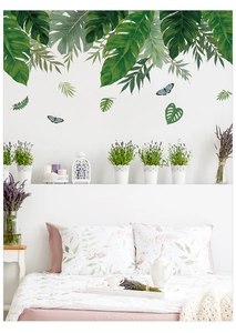 Détails d'autocollants muraux avec feuilles tropicales vertes et papillons pour la chambre