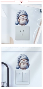 Détail d'un sticker hibou avec bonnet de nuit appliqué sur un interrupteur mural