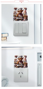 Highland cow chef wall sticker applied above light switch and power socket on white wall