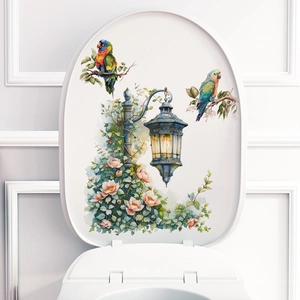 Floral toilet lid decal featuring vintage street lamp, pink roses, and parrots
