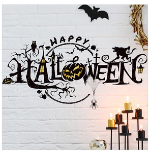 Macro shot of Happy Halloween black wall decals with pumpkin and owl on a white brick wall