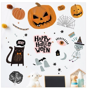 Detail of Halloween window decals featuring cute pumpkins, ghosts, and black cats on a wall