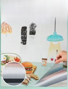 Detail of kitchen wall sticker showing self-adhesive air guide groove and cartoon design