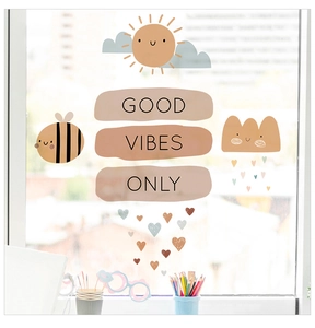 Detail showing cartoon cloud and sun window stickers with Good Vibes Only text on glass