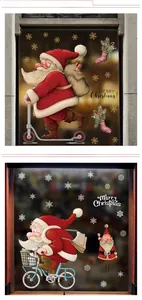 Detail view of Santa Claus window stickers with golden snowflakes and Merry Christmas text