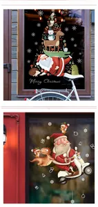 Detailed Christmas window stickers showing Santa and cartoon animals on glass surface