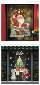 Detail of Christmas window stickers featuring Santa, snowman, and tree on glass pane