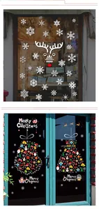 Detail view of festive Christmas window stickers featuring Santa and snowflake patterns
