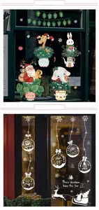 Detailed view of colorful cartoon Christmas stickers and white snowflake window decals