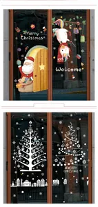 Close-up of colorful Christmas window stickers with Santa Claus and festive silhouettes