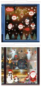 Close-up of Christmas window stickers featuring Santa Claus and reindeer on glass