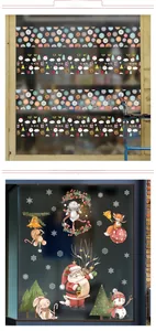 Detail view of festive window stickers with Santa, snowman and snowflakes on glass