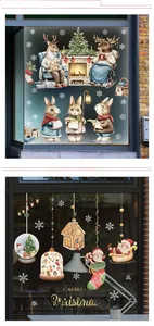 Detail showing Christmas window stickers with festive reindeer, snow, and holiday scenes