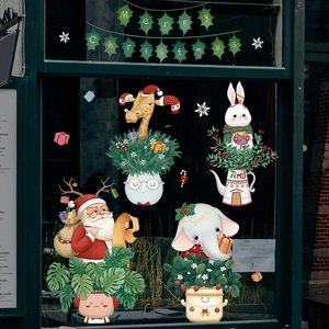 Christmas window stickers featuring cartoon animals, Santa, and Merry Christmas banner
