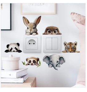 Detailed view of creative animal wall stickers showing rabbit and owl on light switch