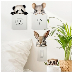 Detail view of cute animal wall stickers peaking from behind power outlets and switches