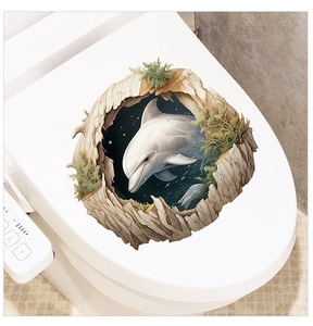 Macro detail of 3D dolphin toilet seat sticker with realistic jumping effect