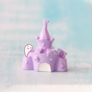 Detail of purple resin castle craft with 3D seashells and cute ghost sticker