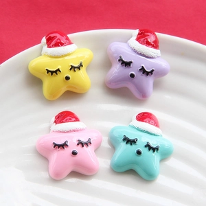 Cartoon star resin charms with red Christmas hats in yellow, purple, pink, and green