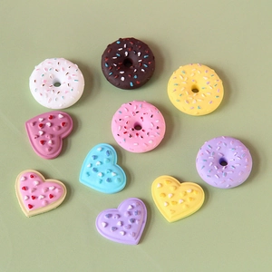 Colorful resin donuts and heart-shaped DIY charms for phone case and keychain crafting