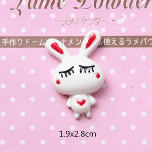 Macro shot of 1.9x2.8cm cartoon white rabbit resin charms for DIY hair accessories