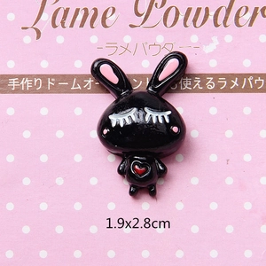 Detail of 1.9x2.8cm black resin bunny charm with red heart and pink ears for DIY