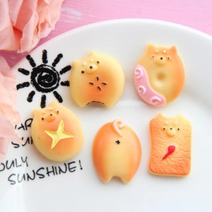 Detailed macro shot of various cute resin food play charms with animal themes