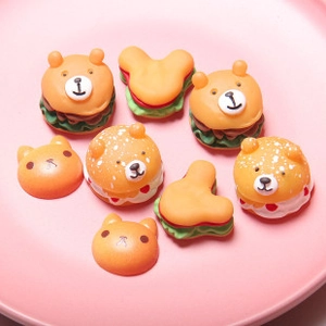Macro view of assorted resin miniature animal burgers for DIY crafts and accessories
