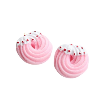 Pink spiral Christmas donut charms with white cream topping for DIY crafts