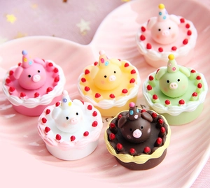 Detailed set of six colorful 3D resin miniature pig cupcake figurines in a heart tray