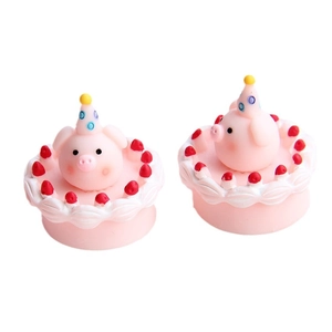 Miniature pink resin pig cake figurines with strawberry details for DIY dollhouse decor