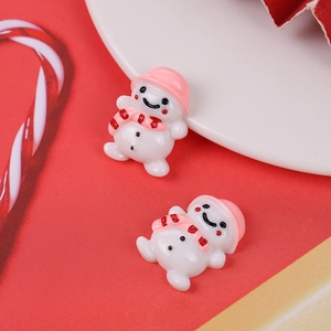 Detailed macro shot of cute resin snowman charms for Christmas DIY craft and phone case