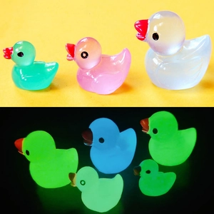 Luminous resin duck miniatures in pink, green, and white for DIY ocean bottle decor
