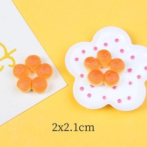 Macro detail of 2x2.1cm flower-shaped miniature bread resin accessories for DIY crafts