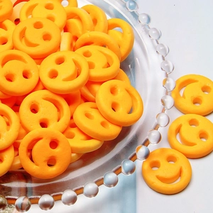 Bright yellow resin smiley face charms for DIY jewelry and hair accessories crafting