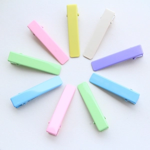 Macro view of 4.8cm macaron colored rectangle metal hair clips in a radial layout