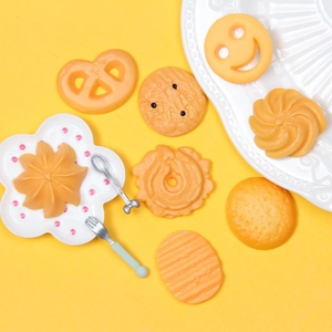 Detailed macro shot of assorted resin cookie charms for DIY jewelry and crafts