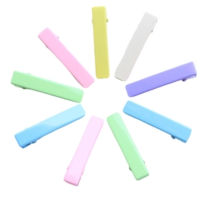 Colorful 4.8cm macaron duckbill hair clips set in a circular arrangement on white background