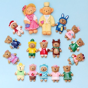 Close-up of assorted resin cartoon bear charms for DIY phone cases and hair accessories