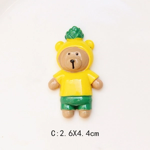 Detailed view of resin bear charm in pineapple costume with 2.6cm x 4.4cm size scale