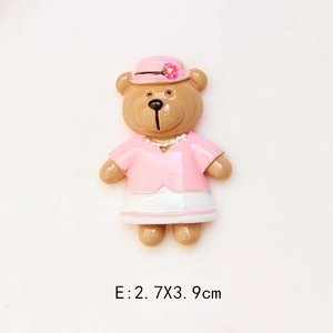 Detail view of cartoon resin bear accessory in pink outfit measuring 2.7x3.9cm