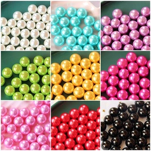 Macro detail of multi-colored glossy pearl beads for DIY craft and phone case decoration