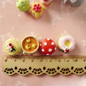 Miniature resin mushroom and dessert charms for DIY crafts measured with a ruler