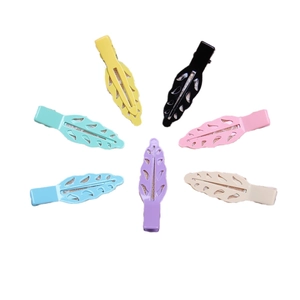 Seven leaf-shaped matte metal hair clips in various colors with a hollow vein design