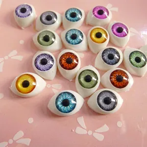 Macro detail of 12mm realistic BJD doll eyes in assorted vibrant iris colors and glossy finish