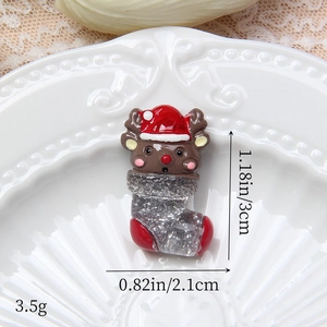Vue détaillée des dimensions du charme de renne de Noël en résine avec chaussette
