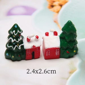 Detailed macro view of 2.4x2.6cm resin Christmas miniature house and festive green tree